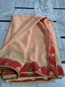 Elegant Peach Saree with Red Border