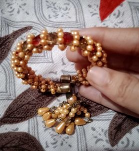 Elegant Golden Beaded Bracelet with Red Stones