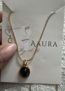 Elegant Gold Necklace with Black Stone