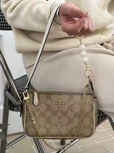 COACH NOLITA DAISY APPLIQUE BAG, FEATURE WITH A PE