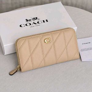 Coach Accordion Zip wallet featuring pillow quilti