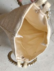 Cream Coloured Jacquard Wrist Pouch