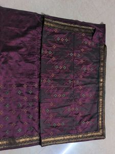 Elegant Purple Saree with Intricate Patterns