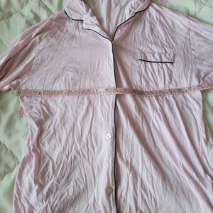 This Victoria's Secret satin pajama top features a