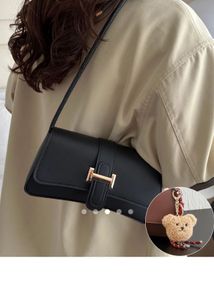 Chic Black Shoulder Bag with Charm