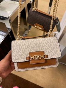 MICHAEL KORS**SIGNATURE LOGO PRINT HEATHER BAG*