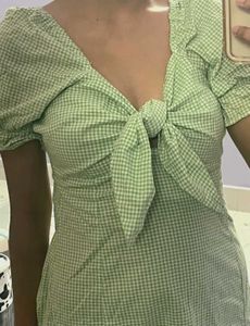Green tie on summer dress