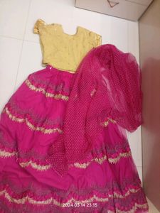 golden choli and dark pink ghaghra with duppatta