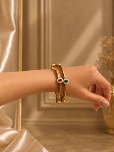 Elegant Gold Tone Bangles with Gemstones