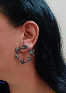 Brass round flying bird earring