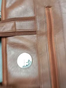 👜