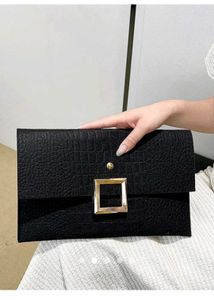 Elegant Black Clutch with Gold Buckle
