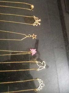 Set of dainty gold necklaces with charms