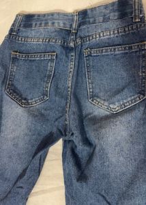 Distressed Blue Denim Jeans