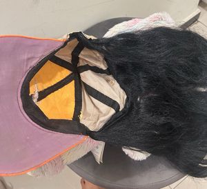 Cap with hair attached