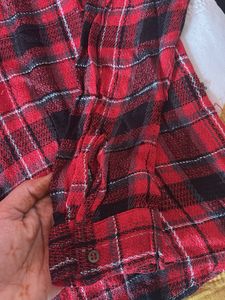 Red and black plaid flannel shirt.