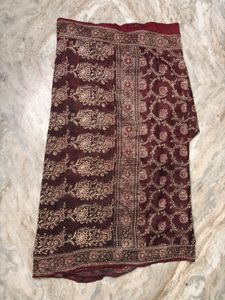 Elegant Maroon Silk Saree with Golden Floral Desig