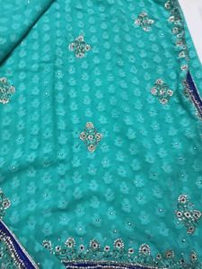 Stunning Teal Saree with Embellished Blouse