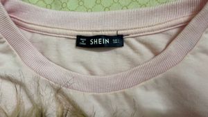 Shein pink crop sweatshirt with a wolf design