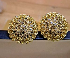 golden round studs