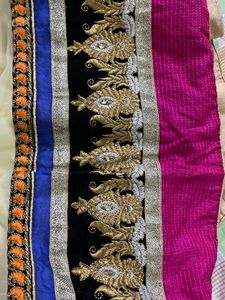 cream colour embroidered  heavy border  full flared lehnga with net heavy border dupatta