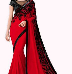a beautiful red saree with blouse