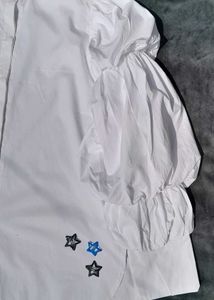 White balloon-sleeve shirt.
