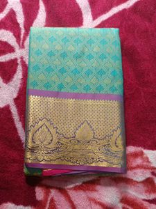 Beautiful Teal Saree with Gold Border