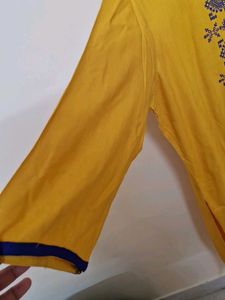 Elegant Yellow Kurta with Embellished Neckline