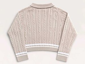 CABLE KNIT POLO SWEATER.