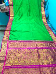 Vibrant Green Silk Saree with Pink Border