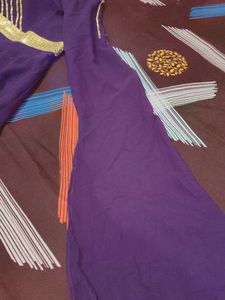 Elegant Purple Gown with Gold Embellishments