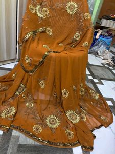 Looking  wow Brown Embroidered Saree