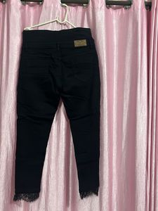 Stylish Black Lace Hem Jeans
