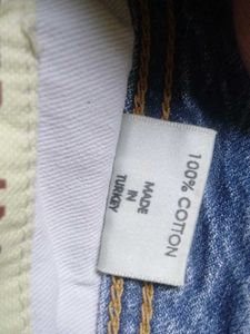 Distressed Blue Denim Jeans