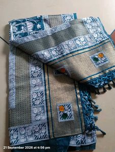 Elegant Teal Saree with Intricate Designs