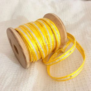 Yellow saree border with golden Silver Stripes