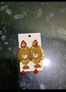 Golden Jhumka Earrings with Red Stone