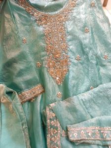 Exquisite Teal Kurta Set with Intricate Embellishm