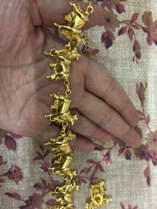 Gold-tone Nandi bell Necklace and Earring Set