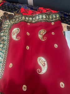 Elegant Red Saree with Paisley Embroidery