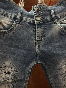 Distressed Denim Jeans with 'Girl' Graphic