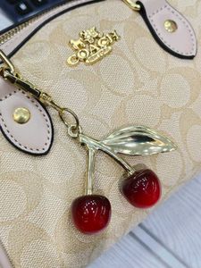 Pink Coach Monogram Cherry Charm Bag DUFFLE SLING