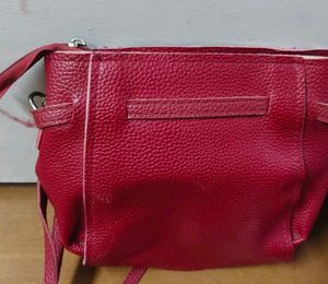 Red sling purse