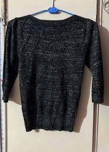 Black stylish top with shimmery interlacing