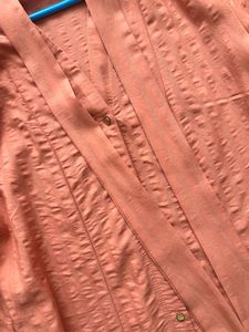 Elegant Peach Blouse with Tie Detail