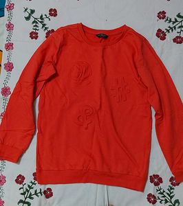 red Crew Neck Sweatshirt with Embossed Symbols