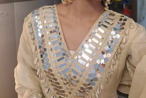 cowrie shells and mirror work kurta set