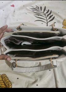 Stylish Beige Textured Handbag with Butterfly Char