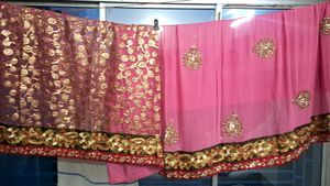 Elegant Pink Saree with Intricate Embellishments